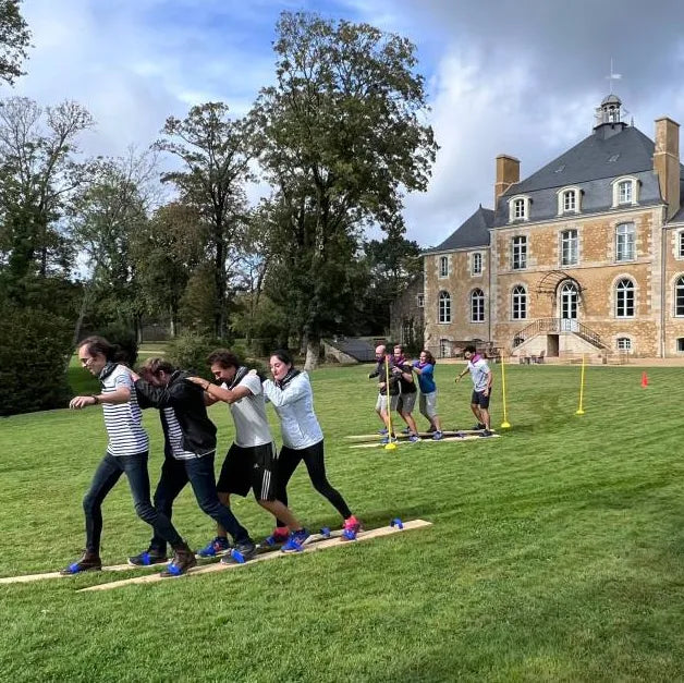 Séminaire Team Building Bretagne cohésion jeux olympiques Biathlon skis géants JO 2024